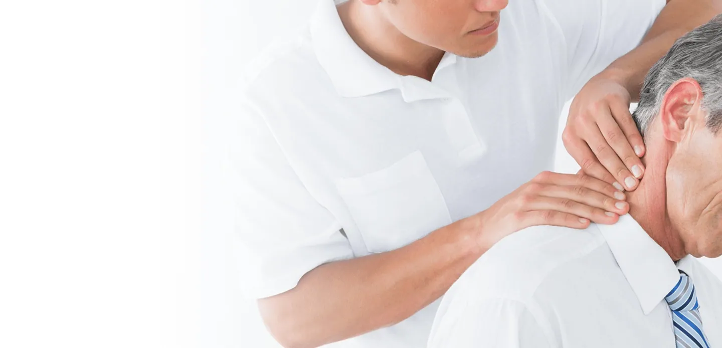 Chiropractor treating a patient's neck pain
