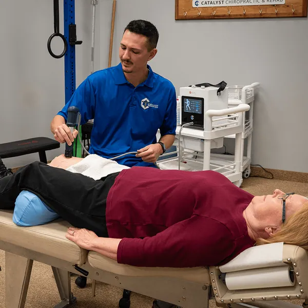 Patient receiving shockwave therapy at Catalyst Chiropractic and Rehab