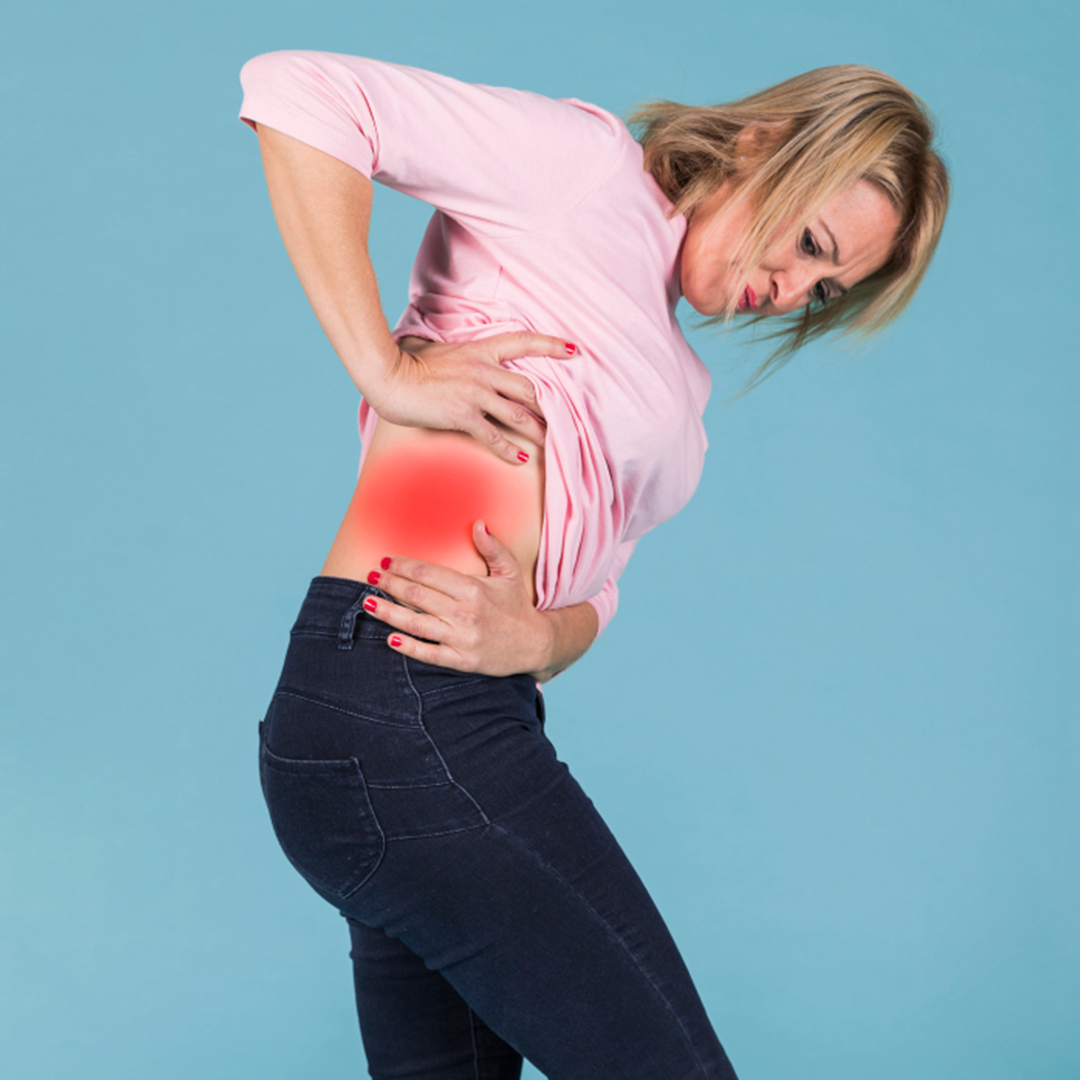 woman standing having red spot on her hip, hip pain treatment