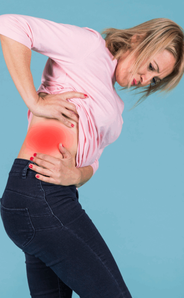 blonde woman standing sideview showing her hip pain spot in red